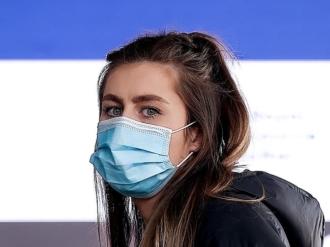 MELBOURNE, AUSTRALIA - NewsWire Photos 24 AUGUST 2021 : A young woman lines up at the Melbourne Convention Exhibition Centre to get a Covid-19 vaccination. Picture : NCA NewsWire / Ian Currie