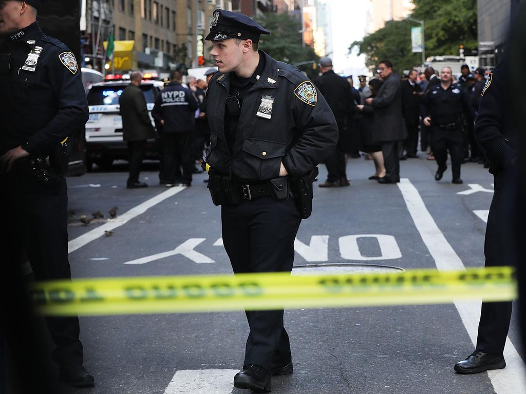 Police gather outside the Time Warner Centre after an explosive device was sent to the CNN offices. Picture: AFP