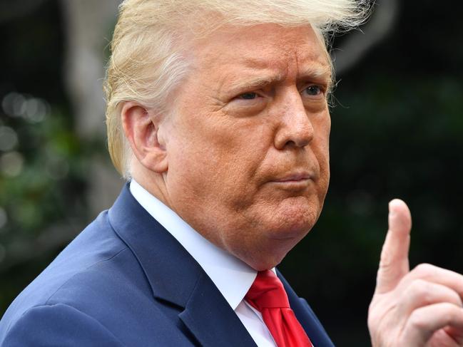 (FILES) In this file photo US President Donald Trump speaks as he departs the White House in Washington, DC, on July 31, 2020 en route to Florida. - Media will be barred from the Republican National Convention in North Carolina later this month, US news outlets reported, when President Donald Trump will formally receive his party's nomination. Soaring coronavirus cases have already forced Trump to cancel the part of the convention planned for Florida's Jacksonville in July. "We are planning for all of the Charlotte activities to be closed press: Friday, August 21-Monday, 24th given the health restrictions and limitations in place in the state," the convention spokesperson had told the Arkansas Democrat Gazette. (Photo by Nicholas Kamm / AFP)