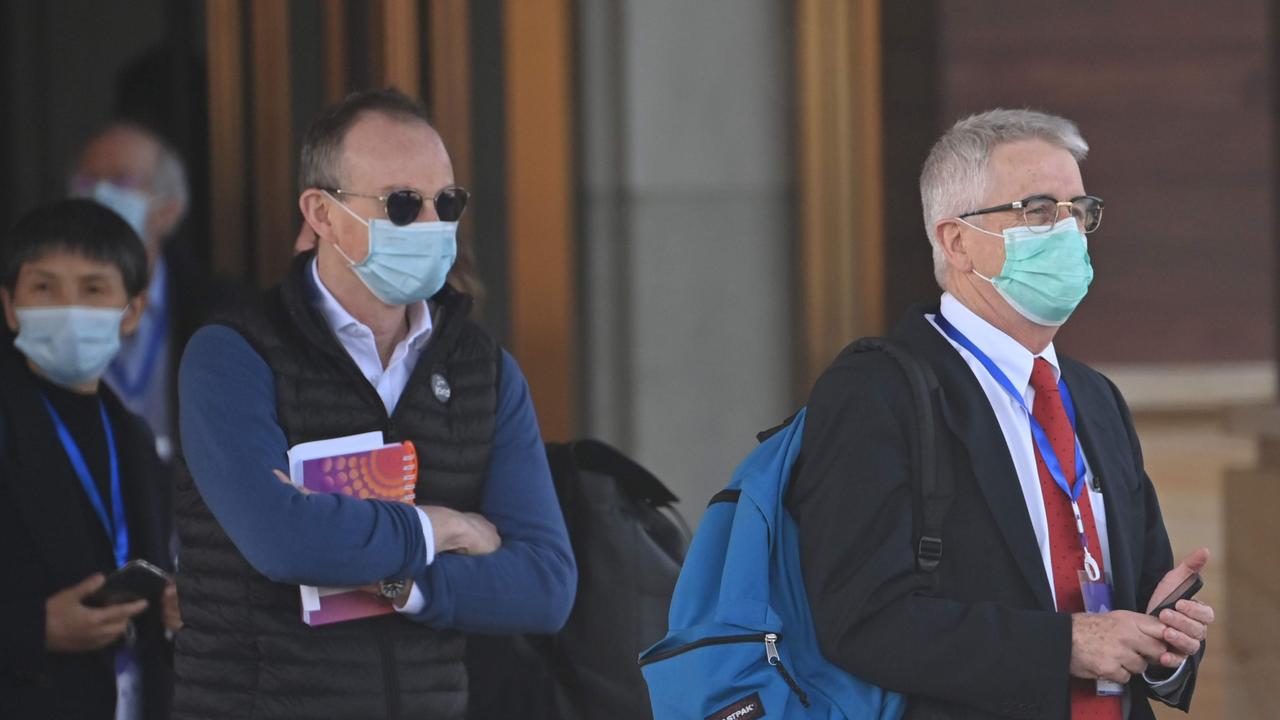 Dominic Dwyer (right) and other members of the World Health Organisation team pictured in Wuhan. Picture: Hector Retamal/AFP