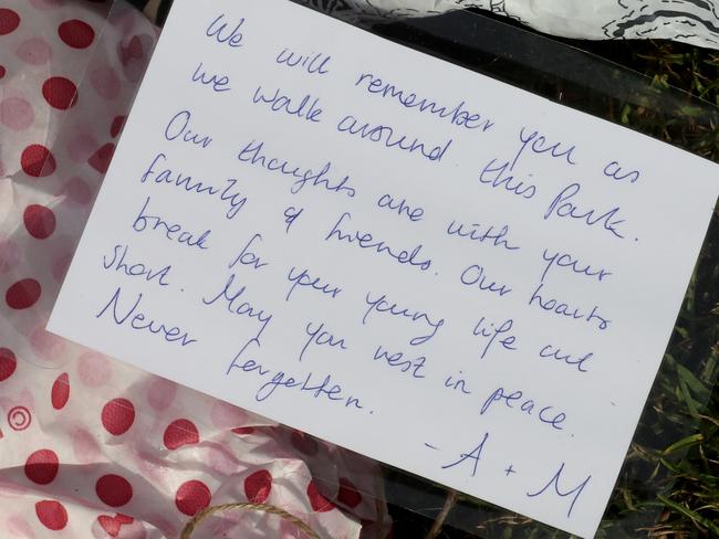 A message on a flower tribute at a makeshift memorial for Eurydice Dixon. Picture: AAP Image/David Crosling