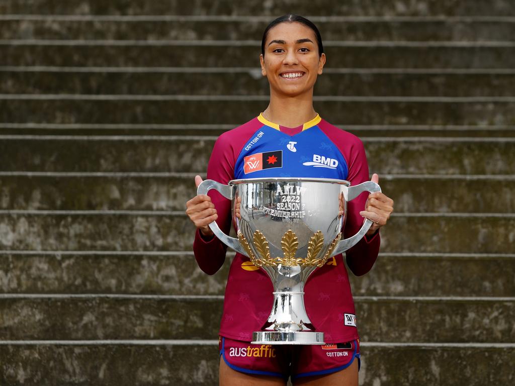 Lions player Zimmorlei Farquharson shows off the AFLW trophy at Wednesday’ finals launch. Picture: Dylan Burns/AFL Photos via Getty Images