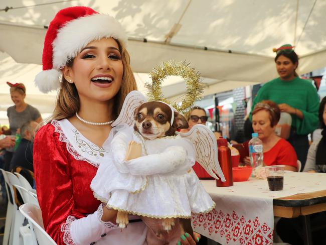 Diana Casanova with her dog at the Wayside Chapel's Christmas Party. Picture: Richard Dobson