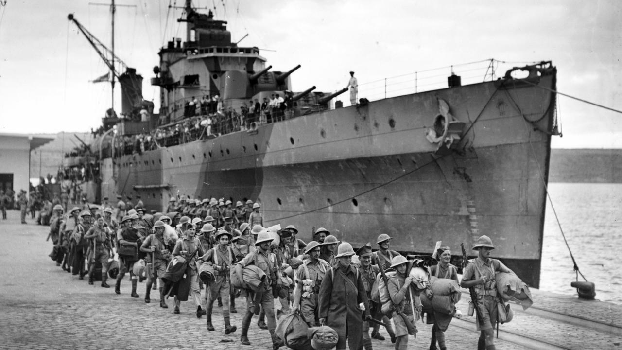 Troops disembark from HMAS Sydney during World War II in an undated copy photo.