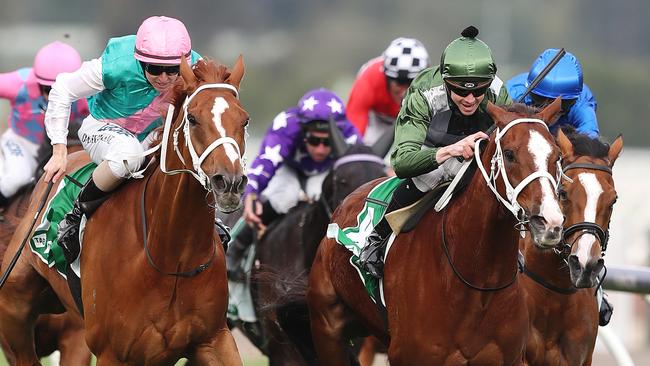 Kings Will Dream ridden by Jye McNeil (green cap) edges Finche, ridden by Damian Lane (pink cap), to win the Turnbull Stakes. Picture: Michael Klein.