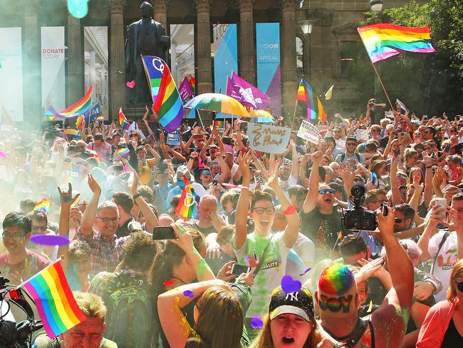 Thousands of people outside Melbourne’s State Library celebrate as the Yes result is announced. Picture: Getty