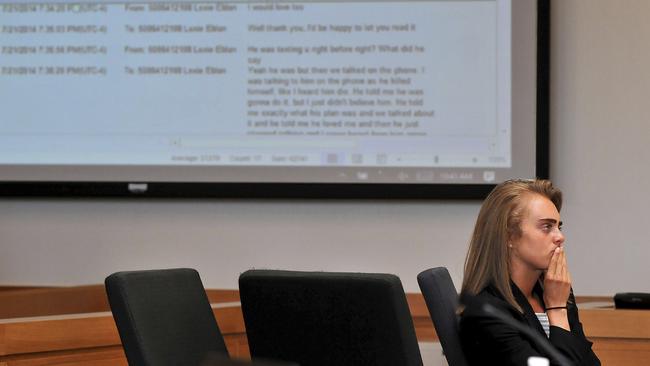 Defendant Michelle Carter looks on as a string of her text messages are projected behind her in court. Picture: Mark Stockwell/The Sun Chronicle via AP.