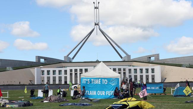 Climate change protesters set up tents on the lawns of Parliament House in Canberra. Picture: NCA NewsWire / Gary Ramage
