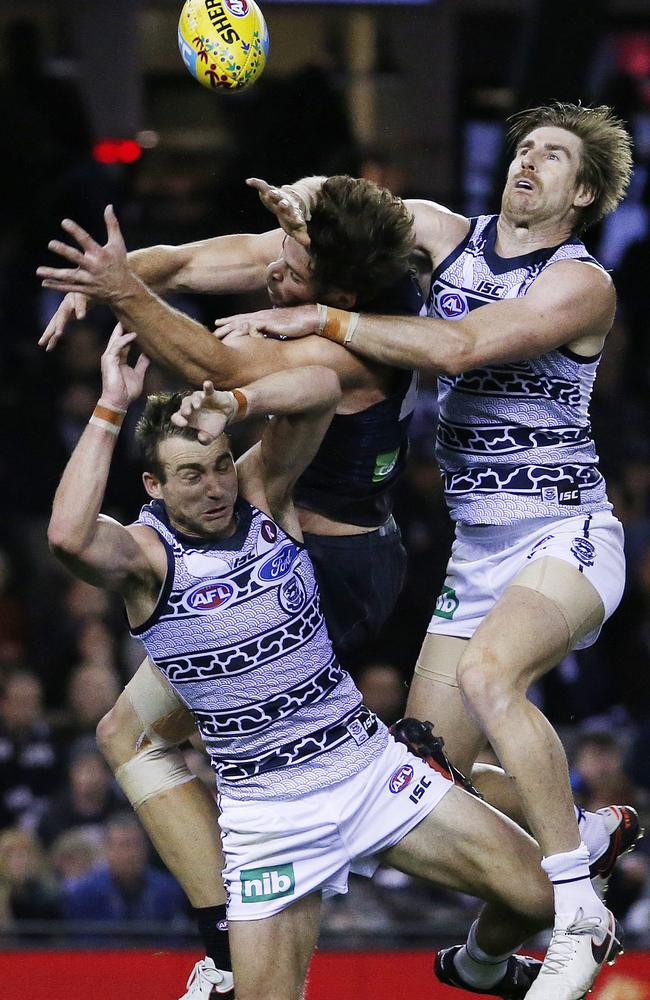 Carlton forward Levi Casboult crashes into Geelong pair Corey Enright and Tom Lonergan. Picture: Colleen Petch