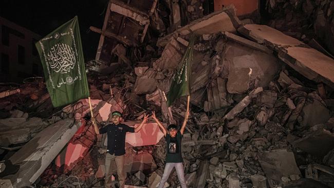 Palestinians celebrate the cease-fire agreement between Israel and Hamas on May 21. Picture: Getty