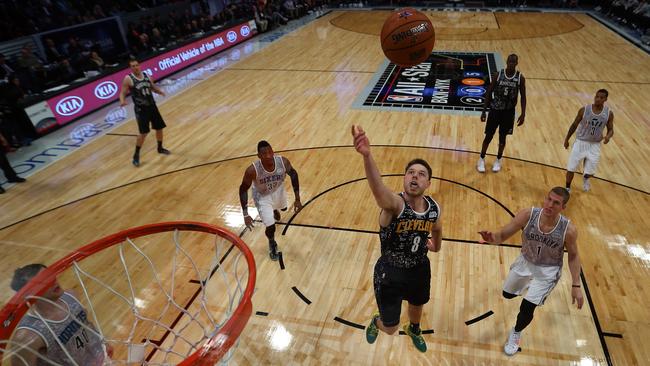 World Team's Matthew Dellavedova #8 of the Cleveland Cavaliers rebounds the ball during the BBVA Compass Rising Stars Challenge.