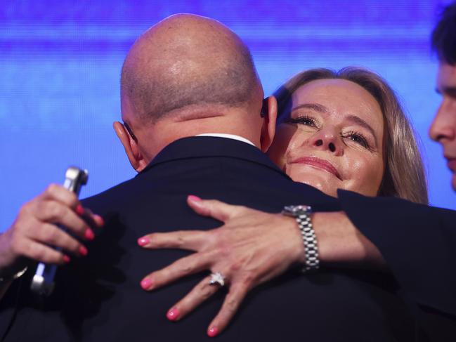She hugged her husband. Picture: AP Photo/Pat Hoelscher