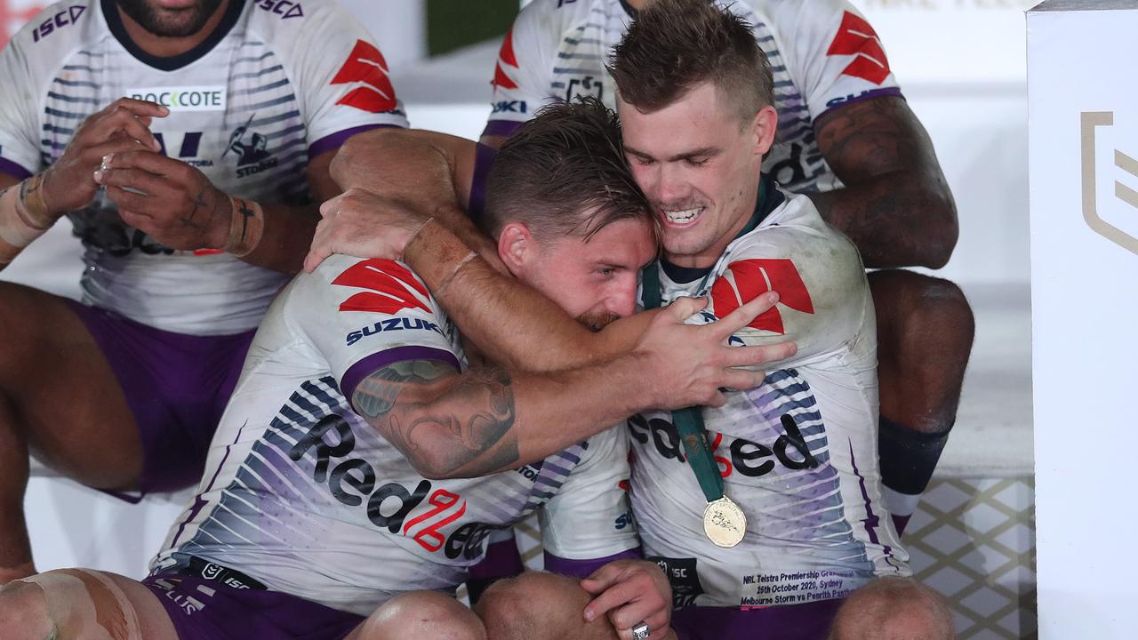 Cameron Munster (L) and Ryan Papenhuyzen celebrate grand final victory. Picture: Brett Costello