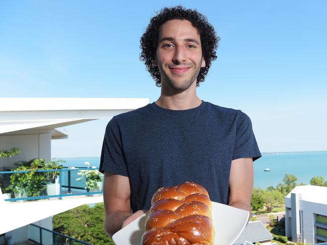 Jordan Kolsky is one of an estimated 200 Jewish people who call the NT home. Kolsky holds a loaf of Challah bread which is usually braided and typically eaten on ceremonial occasions such as Sabbath and major Jewish holidays.Picture: Keri Megelus