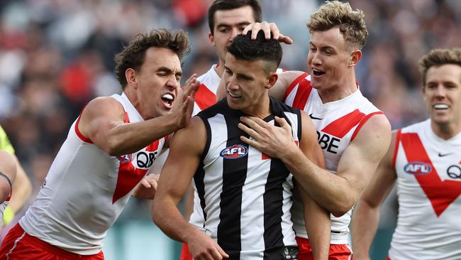 MELBOURNE. 06/05/2023. AFl.  Round 8. Collingwood vs Sydney at the MCG. Swans players get stuck into Nick Daicos of the Magpies after a  Ryan Clarke 1st qtr goal   . Pic: Michael Klein