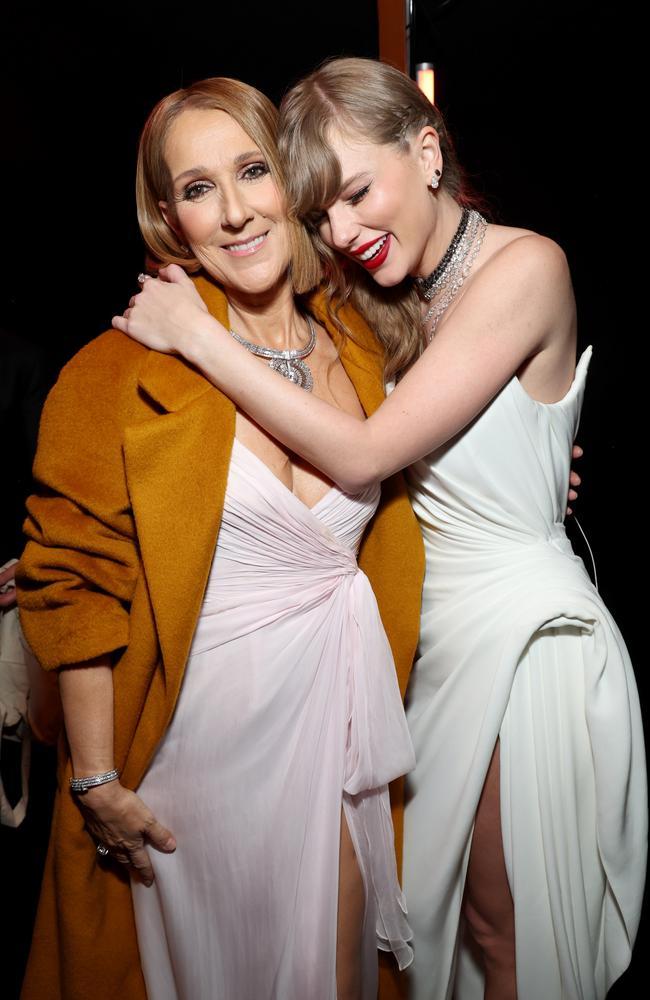 Celine Dion and Taylor Swift embrace each other backstage after Swift snubbed Dion on stage while accepting her Album of the Year award. Picture: Getty Images