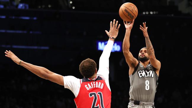 Australian Boomer captain Patty Mills shoots for the Brooklyn Nets in their NBA game against the Washington Wizards.