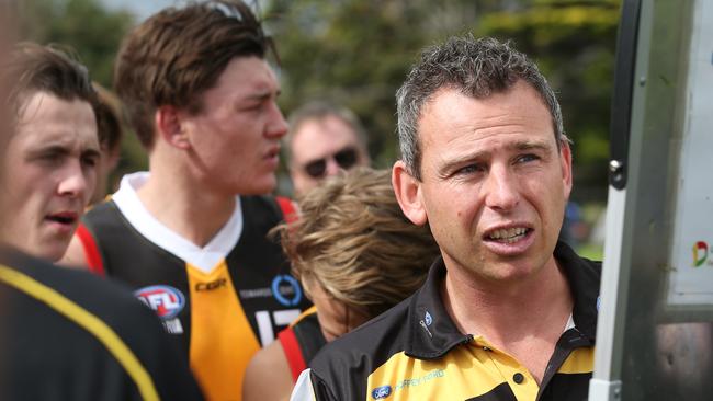 Craig Black works the whiteboard with the Dandenong Stingrays.