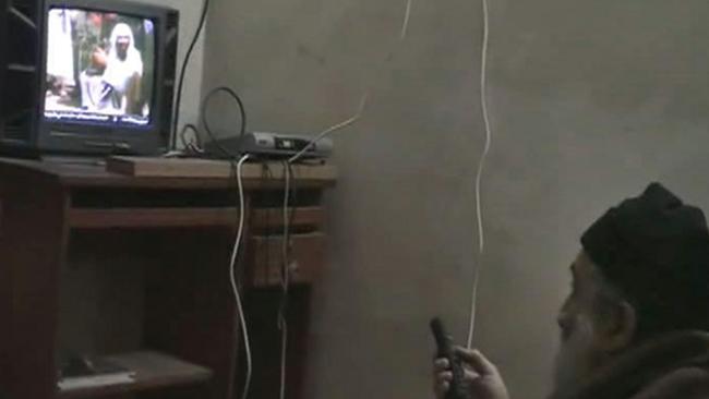 Osama bin Laden watches TV in the Abbottabad compound.