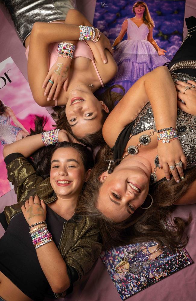 Swifty fans Maya O’Loughlin, Kaitlyn Thomas and Tilly Rose with their many bracelets. Picture: Tony Gough