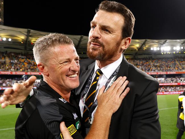 BRISBANE, AUSTRALIA - OCTOBER 24: Damien Hardwick, Senior Coach of the Tigers and CEO Brendon Gale celebrate during the 2020 Toyota AFL Grand Final match between the Richmond Tigers and the Geelong Cats at The Gabba on October 24, 2020 in Brisbane, Australia. (Photo by Michael Willson/AFL Photos via Getty Images)