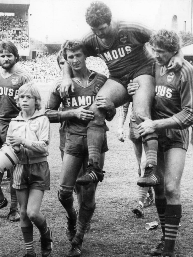 Arthur Beetson with the Parramatta Eels after the 1980 reserve-grade grand final. While they lost, the retiring Artie was chaired off by Ed Sulkowicz and Phil Mann, with Eric Grothe Sr at left.