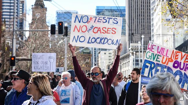 SYDNEY, AUSTRALIA – NewsWire Photos – JULY, 24, 2021: Protesters march down George St during a protest to rally for freedom of speech, movement, choice, assembly, and Health in Sydney. Picture: NCA NewsWire/Flavio Brancaleone