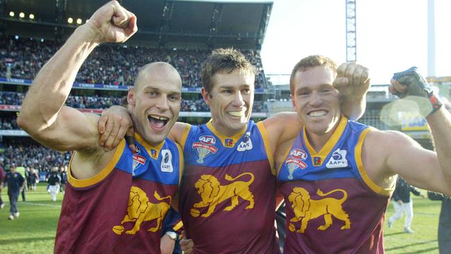 Martin Pike with premiership teammates Alastair Lynch and Justin Leppitsch.