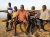 Gumatj clan leader Galarrwuy Yunupingu (red shirt) and his brother Djawa Yunupingu (blue stripes), with Madarrpa clan leader and Prime Minister's indigenous advisory council member Djambawa Marawili (green), senior Djapu clan leader Barayuwa Mununggurr (red stripes and beard) and senior Marrakulu clan leader Wukun Wanambi, pictured on the beach at Yirrkala in northeast Arnhem Land. The Yolngu elders met to discuss what to tell Prime Minister Tony Abbott when he arrives on Sunday for a week-long visit, part of an election promise to spend a week in an indigenous community every year.