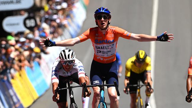 MOUNT LOFTY, AUSTRALIA - JANUARY 21: Stephen Williams of United Kingdom and Team Israel - Premier Tech - Orange Santos Leader's Jersey celebrates at finish line as stage winner ahead of Isaac Del Toro Romero of Mexico and UAE Team Emirates and Jhonatan Narvaez of Ecuador and Team INEOS Grenadiers during the 24th Santos Tour Down Under 2024, Stage 6 a 128.2km stage from Unley to Mount Lofty 648m / #UCIWT / on January 21, 2024 in Mount Lofty, Australia. (Photo by Tim de Waele/Getty Images)