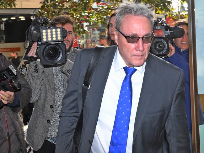 Australian Tax Office Deputy Commissioner Michael Cranston arrives at the Downing Centre Courts in Sydney, Tuesday, June 13, 2017. Cranston is expected to be charged in relation to an unprecedented white-collar fraud scandal allegedly linked to his son and daughter. (AAP Image/Dean Lewins) NO ARCHIVING