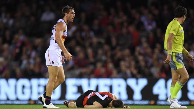Zach Merrett was collected by a huge bump from Richard Douglas.