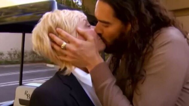 Russell Brand appeared to pull Hayes close to him before planting a kiss on her lips. Picture: Nine