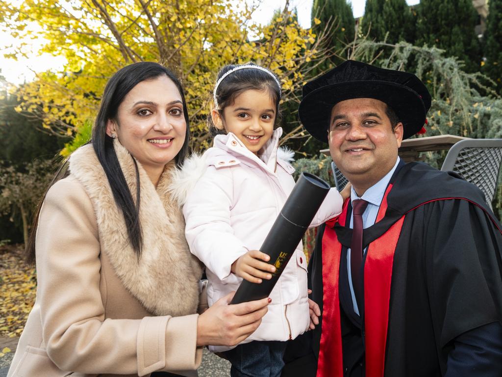 Doctor of Philosophy graduate Arvind Sharda with wife Ritu Sharma and daughter Violet Sharda at a UniSQ graduation ceremony at Empire Theatres, Wednesday, June 28, 2023. Picture: Kevin Farmer