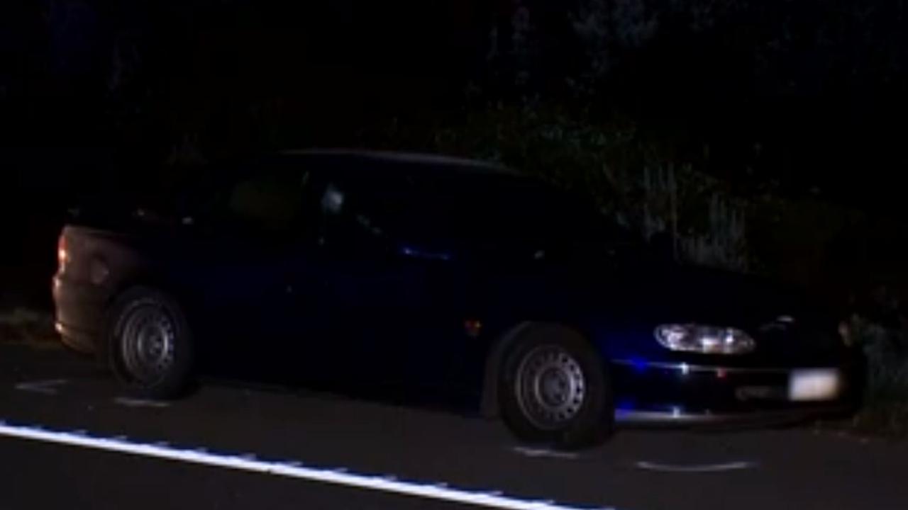 The blue Holden Commodore sedan was stationary on the side of the freeway. Picture: 7NEWS