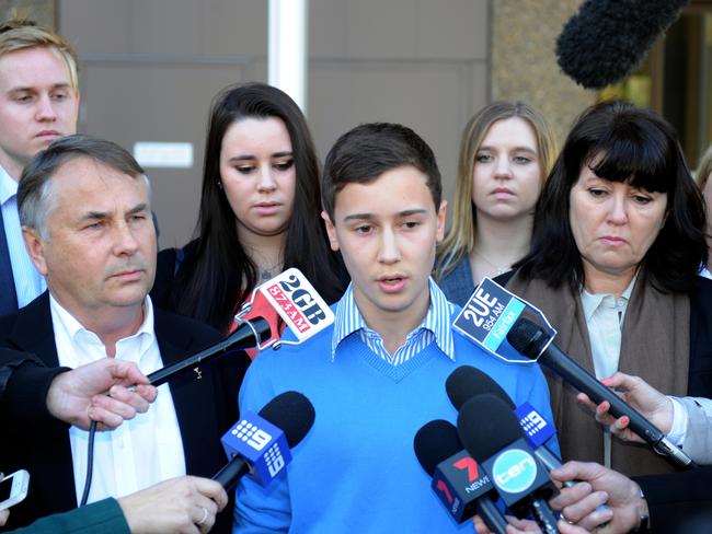 Stuart Kelly with parents Ralph and Kathy after Thomas’s killer was sentenced. Picture: AAP Image/Dean Lewins