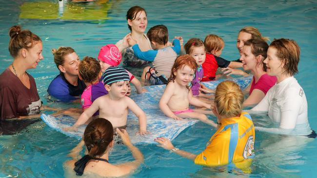 Mums and babies at a learn to swim class called Kidswim at Action Indoor Sports at Mt Kuring-gai.