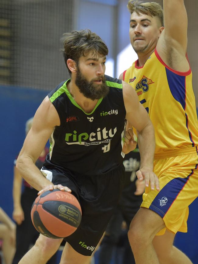 Rip City player Josh Tueta looks for support against Brisbane Capitals at the USC Sports Stadium.