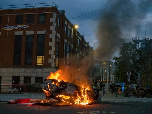 A police car is set on fire as far-right activists hold an ‘Enough is Enough’ protest in Sunderland on August 02. Picture: Getty Images