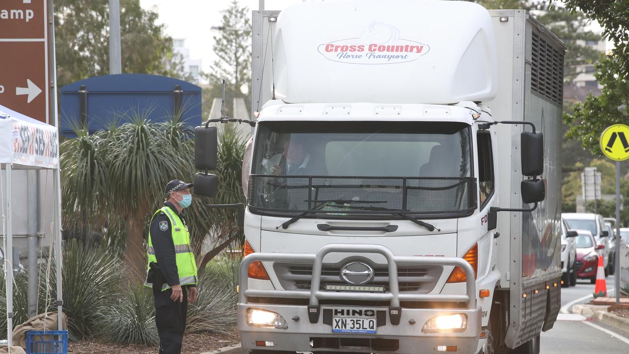 The hard border and long Queues return to the Qld NSW border on the Gold Coast. People getting the thumbs up or turned away in Griffith St Coolangatta. Picture: Glenn Hampson.