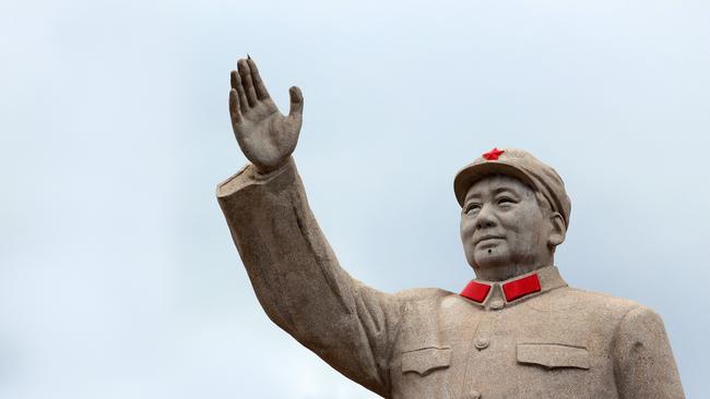 A statue of Mao Zedond in central Lijiang. The city is famous for its UNESCO Heritage Site, the Old Town of Lijiang.