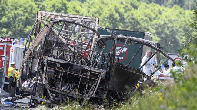 Dozens are feared dead after a bus carrying a group of German senior citizens crashed into a truck on a highway in Bavaria and burst into flames. Picture: Matthias Balk/dpa via AP