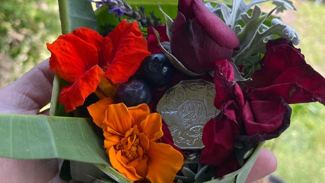 'Angel of Bali' Hanabeth Luke with a Balinese offering she made to remember those lost in the terror attack in Bali. Picture: Supplied