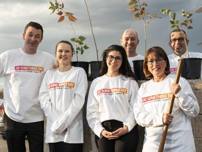 Staff Craig Epton, Hannah Grey, Jessica Ciccone, Graeme Derrig, Jill Teeling and Frank Marrapodi get their tools ready to plant trees for DoSomething Day. Picture: Matthew Vasilescu