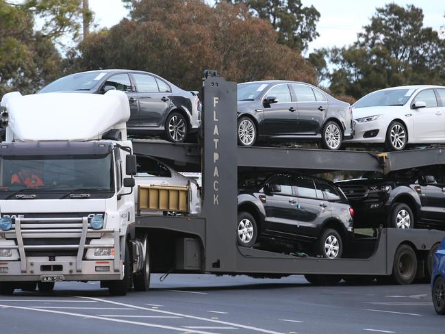 A truck rolls out with Ford vehicles on the last shift for the Ford Broadmeadows plant in Victoria. Picture: David Crosling