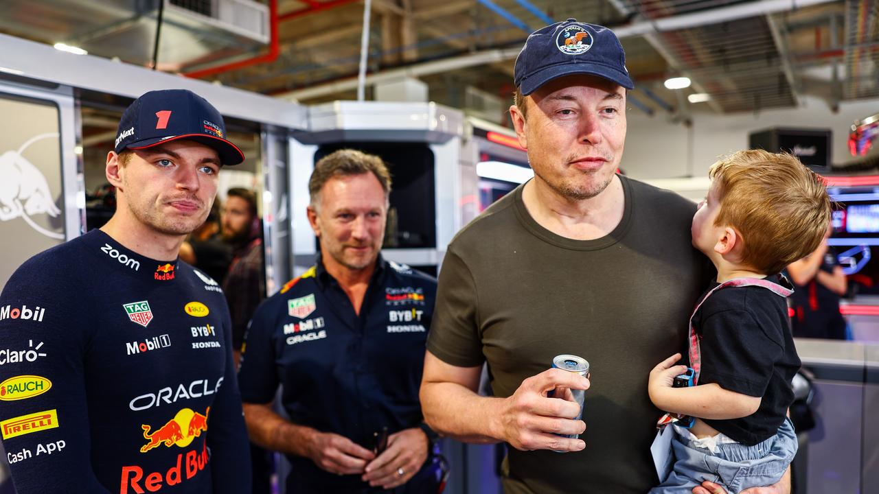 Max Verstappen of the Netherlands and Oracle Red Bull Racing, Red Bull Racing Team Principal Christian Horner and Elon Musk talk in the garage. (Photo by Mark Thompson/Getty Images)