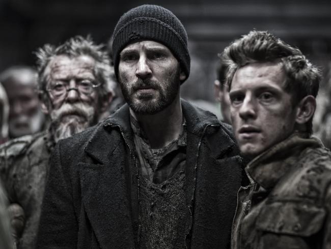 L-R: John Hurt, Chris Evans and Jamie Bell in a scene from film Snowpiercer