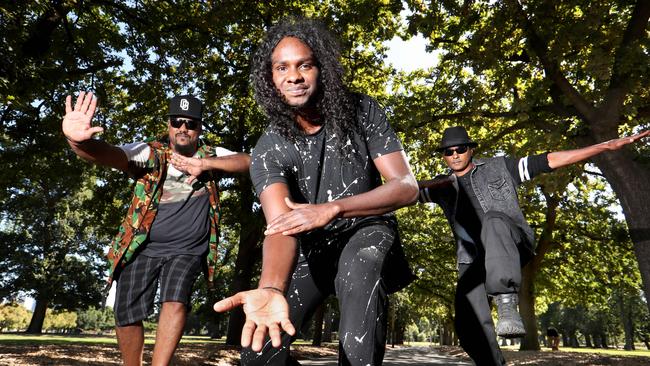 Danzal Baker with his uncle Jeremiah Baker and his father, Josiah Baker, in Fitzroy, Melbourne. Picture: David Geraghty