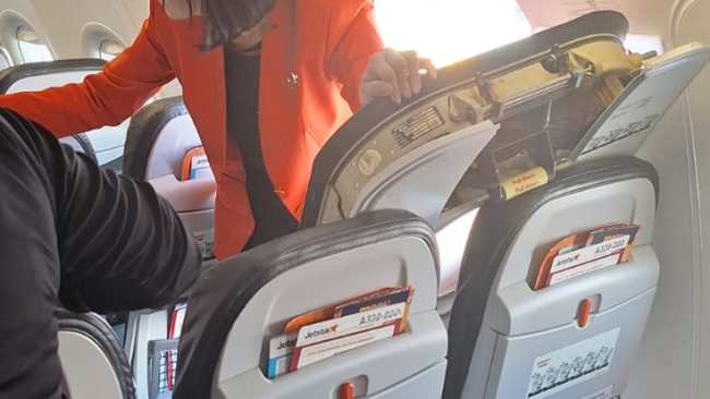 “Didn’t take anyone else with me”: Jetstar passenger gives shocking account of watching a man break open the emergency exit of a plane after landing