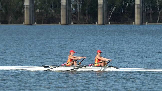 A pair of Stuartholme School rowers head out on to the course during the Queensland Secondary Schools Rowing Championships in Rockhampton.